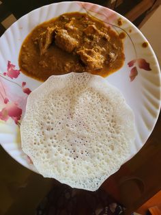 a paper plate with some food on it