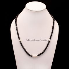 Product Details :  ITEM : BLACK SPINEL AND PEARL BEADED NECKLACE Item Code : DGC2513 Gemstone Name :  BLACK SPINEL, PEARL Chain Style : BEADED Beads Shape : FACETED RONDELLE Beads Size : 5-6/7 mm Approx. Length : 20 INCH WITH LOBSTER CLASP Weight : 170 Cts. Approx. Customization : **Available** Please Feel Free To Contact If You Have Any Query. Elegant Black Rondelle Beaded Necklaces, Black Rondelle Beaded Necklaces, Black Beaded Rondelle Necklace, Black Rondelle Gemstone Bead Necklace, Black Beaded Rondelle Jewelry, Handmade Black Pearl Necklace With Round Beads, Black Single Strand Beads For Jewelry Making, Black Pearl Necklace With Round Beads As Gift, Black Pearl Necklace For A Gift