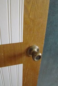 an open door with a metal handle on it