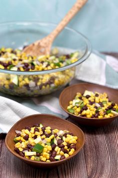 two bowls filled with corn and black beans