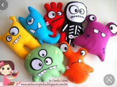 several different colored stuffed toys with faces on them