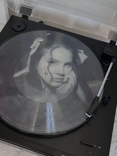 a turntable with a woman's face on it