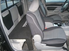 the interior of a vehicle with grey seats