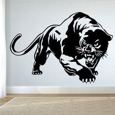 a black and white wall decal of a running panther