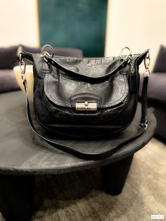 An iconic and beautiful Coach bag, fully leather and timeless. The front clasp, quiet lux, and in perfect condition. The hangtag is intact.  Pre-Loved Excellent Condition  Leather Measurements: 16" x 10.5" Bottom: 4" Drop Strap: 5   35-41" adj Zip closure Inside one zip divider, one zip pocket Coach Kristin Bag, Coach Bag, Vintage Bags, Coach Bags, Purses And Handbags, Shoulder Bags, Zip Pockets, Satchel, Accessory Gift