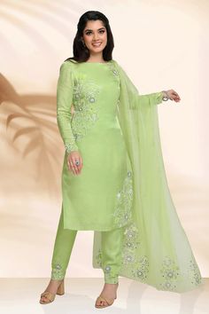 Green kurta embellished with resham, zari and velvet floral embroidery. Paired with a cigarette pant and  heavily embellished scalloped cutwork dupatta.
Components: 3
Pattern: Embroidery
Type Of Work: Floral, Resham, Zari
Neckline: Boat Neck
Sleeve Type: Full Sleeves
Fabric: Kurta and Pant: Gaji Silk, Dupatta: Organza
Color: Green
Other Details: 
Placement floral embroidered dupatta
Occasion: Puja - Aza Fashions Semi-stitched Art Silk Unstitched Suit For Reception, Bollywood Art Silk Unstitched Suit For Reception, Bollywood Style Art Silk Unstitched Suit For Reception, Unstitched Silk Salwar Kameez For Reception, Embellished Chanderi Kurta For Diwali, Designer Embellished Tissue Silk Dupatta, Elegant Embellished Churidar For Reception, Unstitched Dola Silk Suit For Reception With Straight Kurta, Pista Green Salwar Kameez With Mirror Work For Reception