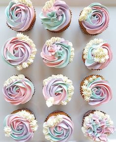 cupcakes with pastel frosting and flowers on them