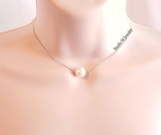 Cream Ball Bead Choker Necklace, Light Beige Faux Pearl Pendant Necklace, Minimalist Add On Layering Necklace, Holiday Jewelry Gift (N378) 12mm vintage, cream lucite pearl bead pendant necklace. 14" with a 3" extender.  Rhodium silver chain. lobster claw clasp closure. #N378 Wanna see more? Click below for other items available: Add On Layering Necklaces: https://www.etsy.com/shop/StudioMJewelry?section_id=42768641 Single Strand Necklaces: https://www.etsy.com/shop/StudioMJewelry?section_id=42768683 Multi-Strand Necklaces: https://www.etsy.com/shop/StudioMJewelry?section_id=42756488 Big & Bold Jewelry: https://www.etsy.com/shop/StudioMJewelry?section_id=42768649 Bracelets: https://www.etsy.com/shop/StudioMJewelry?section_id=42769605 Charm & Bangle Bracelets: https://www.etsy.com/shop/Studi Elegant Shell-shaped Pearl White Necklace, Bead Choker Necklace, Layering Necklaces, Bead Choker, Bold Jewelry, Bead Pendant, Beaded Pendant Necklace, Bangle Bracelets With Charms, Necklace Minimalist