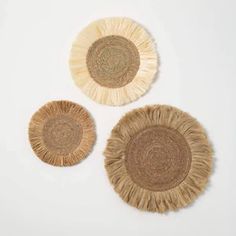 three woven coasters on white background