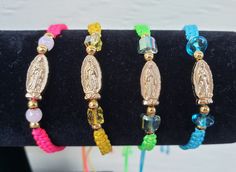 This beautiful Virgen de Guadalupe bracelet is so elegant and simple.  If you believer than you know how miraculous she is! This makes a perfect gift to someone who needs a little help, let them know they are not alone and La Morenita will always be there to protect them and guide them. And it also makes a wonderful gist for any time of the year: birthday, Christmas, baptisms, communion, Mothers's Day. It is handwoven with durable nylon string and has a center gold charm of La Guadalupana and be Guadalupe Bracelet, Catholic Jewelry, Protection Bracelet, Evil Eye Bracelet, Gold Charm, Time Of The Year, Charm Bracelets, Cute Jewelry, Diy Jewelry