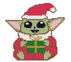 a cross stitch pattern of a baby yoda holding a christmas present