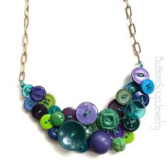 a necklace with many different colored buttons on it