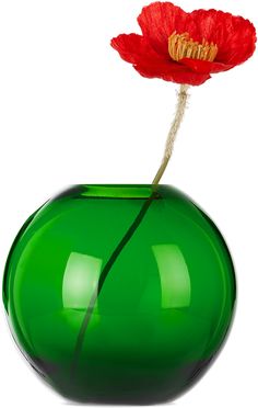 a green vase with a red flower in it's center on a white background