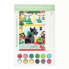 the paint by number kit features a scottie dog and christmas tree, with other holiday decorations