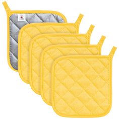 three yellow oven mitts are next to each other