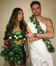 a man and woman dressed up as fruits and vegetables, one is holding an apple