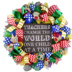 a colorful wreath that says teachers change the world one child at a time