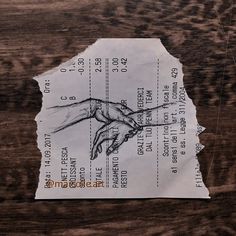 a piece of paper with a drawing of a hand reaching out for something on it