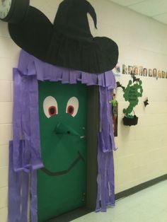 an image of a door decorated to look like a witches hat with eyes and nose