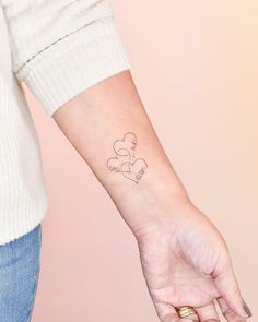 a woman's arm with a tattoo on it that says, i love you