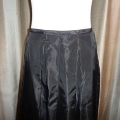 "Striking and stunning long length Black Taffeta Silk Like Skirt which can be dressed up or dressed down and has a classic timeless appeal to it. This is made with 100% Acetate Fabric and is Dry Clean Only. Measurements of this Mint Condition, Never Worn, Long Length Pleated Skirt are as follows: Length: 42\" long Waist: 14.5\" wide, or 28\" all around Hips: 32\" wide or 64\" all around Easy to ship, this will be insured for the price paid against loss and/or damage during transit. Thank you for Elegant Fitted Satin Pleated Skirt, Fitted Satin Pleated Maxi Skirt, Fitted A-line Maxi Skirt With Gathered Detail, Elegant Formal Pleated Skirt With Stretch, Fitted Accordion Pleat Skirt For Evening, Fitted Skirt With Accordion Pleats For Evening, Fitted Satin Pleated Skirt For Party, Fitted A-line Satin Skirt, Full-length Silk Lined Skirt