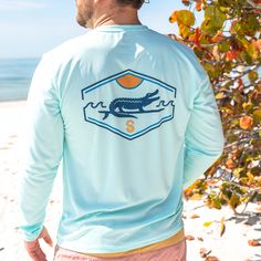 Our high performance solar shirt will keep your skin protected from the sun, whether on the boat or at the beach! With superior protection up to UPF +50, this unisex long sleeve solar shirt is lightweight and super soft. - UPF +50 Ultraviolet protection - 100% Microfiber Polyester - PURE-tech™ moisture wicking technology - Keep Florida Wild design sublimated on the back, Keep Florida Wild signature logo on the front. - Part of the proceeds from the sale of this shirt go to organizations that pro Wild Design, Mens Trends, Sunshine State, The Boat, Signature Logo, Skin Protection, Upf 50, Ultra Violet, At The Beach