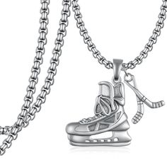 a necklace with a hockey shoe on it and an ice skater charm hanging from the chain