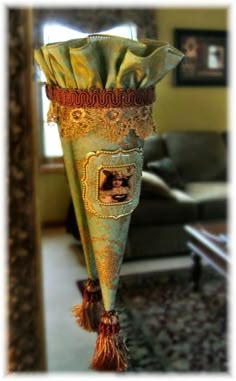 a decorative vase is hanging in the living room