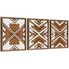 three wooden wall art pieces with geometric designs on the sides and one has a brown frame