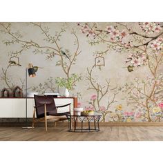 the wallpaper in this room is decorated with flowers and birds