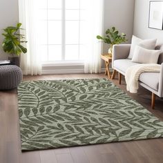 a living room with a large rug on the floor and a chair in front of it