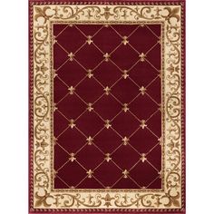 a red and beige rug with an intricate design on the bottom, in front of a white background