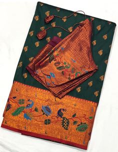 This exquisite Paithani saree features a traditional Peacock border and is adorned with beautiful peacock and floral motifs. The saree comes with a matching blouse piece that can be tailored to fit sizes 34-44 inches. Perfect for adding a touch of elegance to your wardrobe. *Fabric: Silk *Color: Orange with Multicolor Embroidery and Green Details *Blouse Size: 34-44 inches (adjustable) *Border: Traditional  Border *Design: Paithani with intricate peacock and floral motifs *Occasion: Suitable for Traditional Border Design, Traditional Peacock, Multicolor Embroidery, Paithani Saree, Green Details, Beautiful Peacock, Soft Silk Sarees, Fabric Silk, Floral Motifs