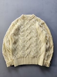 Listing: Vintage 1970s Sears The Men's Store Cable Knit Acrylic Sweater S Size on Tag: 36 Flaws: No major flaws Measurements: Please see the photos in the listing. If you require additional measurements or information about this item, feel free to send a message. Cream Retro Winter Sweater, Vintage Beige Chunky Knit Sweater, Retro Beige Knitted Sweater, Beige Knitted Retro Sweater, Vintage Crew Neck Chunky Knit Sweater, Retro Wool Knitted Sweater, Vintage Chunky Knit Crew Neck Sweater, Men Knitted Sweater, Jumper And Jeans