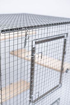 a large metal cage with two doors on top