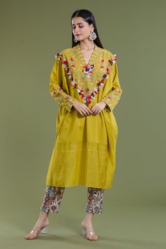 Haldi kaftan with thread, patchwork embroidery in floral pattern. Paired with floral print pant. - Aza Fashions Spring Cotton Kaftan With Floral Embroidery, Spring Traditional Kaftan With Dabka Work, Traditional Dabka Work Kaftan For Spring, Spring Folk Kaftan With Resham Embroidery, Spring Cotton Kaftan With Multicolor Embroidery, Folk Style Cotton Kaftan With Floral Embroidery, Bohemian Dabka Work Sets For Spring, Spring Yellow Cotton Kaftan, Cotton Kaftan With Floral Embroidery In Tunic Shape