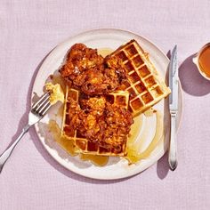 chicken and waffles on a plate with syrup