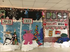 christmas decorations are displayed in front of a bulletin board