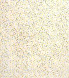 a yellow and white background with small dots