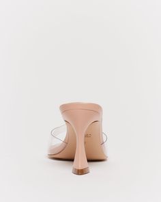 Introducing the FREYA sandal - our effortless mule that is designed to exude understated elegance, making these mules an ideal choice for any outfit. The nude colour combined with the perspex upper complements a variety of colours, ensuring these shoes are a go-to option in your wardrobe. The cushioned insole alongside the flared block heel makes this style not only look stunning but also feel comfortable. Trendy Closed Toe Sandals With Sculpted Heel, Chic Sandals With Padded Heel And Round Toe, Party Sandals With Translucent Outsole And Open Heel, Chic High Heel Sandals With Translucent Outsole, Chic Closed Toe Sandals With Sculpted Heel, Leather High Heel Sandals With Translucent Outsole, Formal Leather Sandals With Translucent Outsole, Trendy Sandals With Sculpted Heel And Round Toe, Medium Width Open Toe Sandals With Reinforced Heel