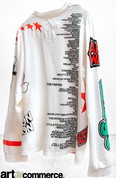 a white long sleeved shirt with red and green writing on it that says art connect