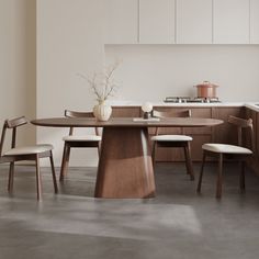 a kitchen with white walls and wooden furniture