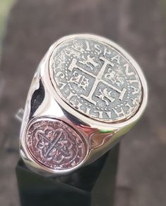 This coin ring has very rich and clean look to it. It's solid sterling silver, and there is a main center coin,  and a small coin on each side that gives this piece a very unique setting. The coins themselves are made from the silver bars recovered from the Atocha and comes with a certificate stating that. I also sign my name on the back so you know you are getting a JackSpirit original design. Sunken Treasure, Treasure Coin, Time Will Tell, Treasure Jewelry, Oxidized Ring, Key West Fl, Coin Ring, Ring Antique, Mens Silver Rings