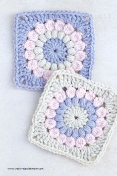 two square crocheted squares sitting next to each other