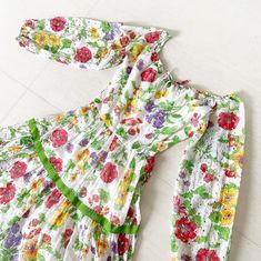 "Hands down one of the most amazing 70s maxi florals ever made. I kid you not. This is not just any floral dress - it is an EYELET LACE FLORAL DRESS. Yes you heard me, that entire fabric is one big eyelet lace With flowers I didn't even know such a thing existed! Colors are amazing and that green and red grosgrain ribbon just makes it pop even more! Absolutely amazing! Condition: Excellent. The elastic neckline seems to have lost some elasticity (I think) although I'm not quite sure if it was ju Lace Floral Dress, Peacock Dress, Floral Lace Dress, 50s Dresses, Eyelet Lace, Green And Red, Floral Maxi, A Thing, Floral Maxi Dress