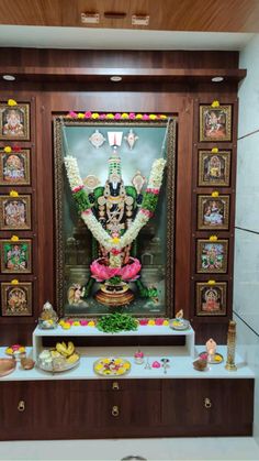 an idol is displayed in the corner of a room