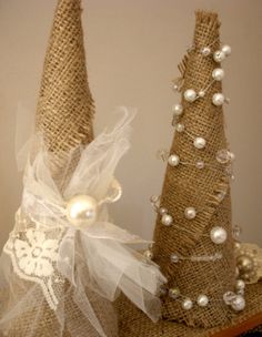 two burlap christmas trees with pearls on them