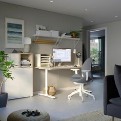 an office with a desk, chair and computer monitor