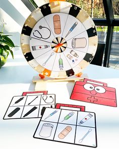 a game set up on top of a table with scissors and other items around it