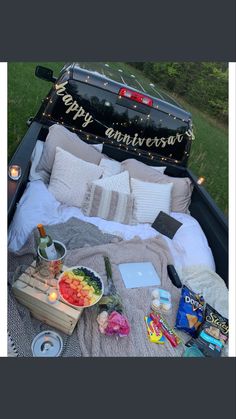 an open truck bed filled with food and drinks